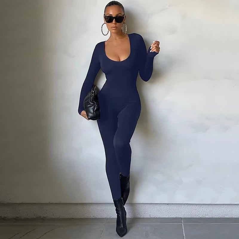 Rosavina Damen-Jumpsuit aus dunkelblauem, dehnbarem Stoff mit langen Ärmeln und U-Ausschnitt, figurbetont.