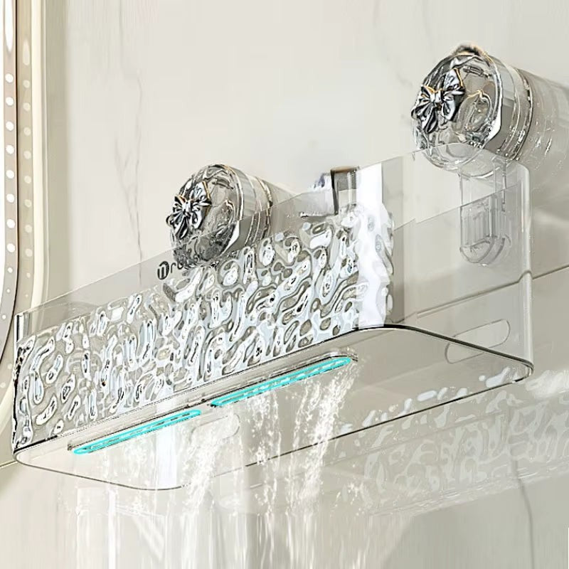 Rosavina Duschregal aus transparentem Kunststoff mit silbernen Saugnäpfen und ornamentaler Vorderseite. Ideal für Shampoo und Duschgel.